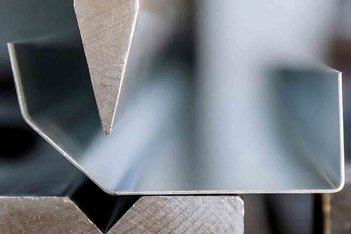 stock-photo-bending-of-galvanized-sheet-metal-on-a-hydraulic-bending-machine-at-the-factory-1815231305-transformed-transformed